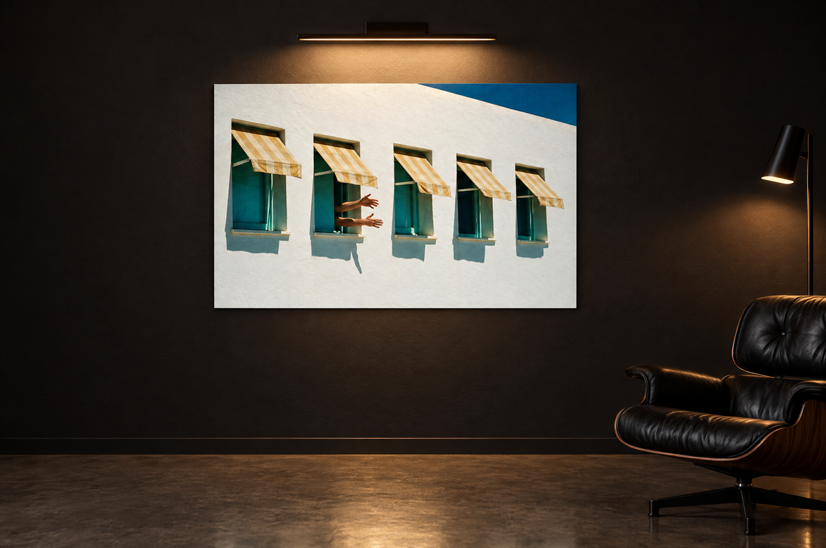 Awning print on a dark gallery wall under a picture light