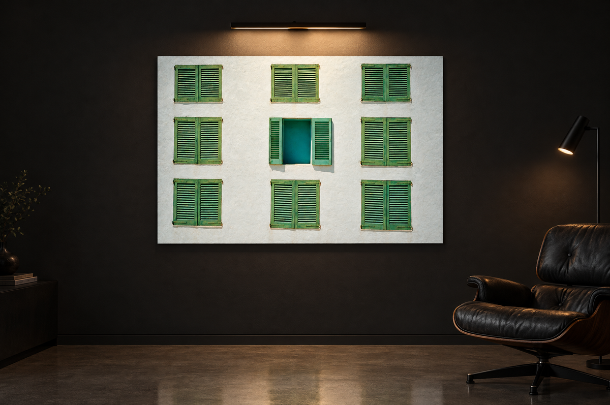 Blinds print on a dark gallery wall under a picture light