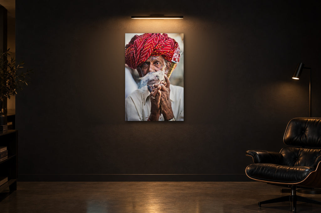 India No. 07 — Red Turban — photo print shown in a dark gallery room under a picture light