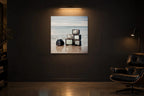Television Project No. 03 — Low Tide — photo print shown in a dark gallery room under a picture light