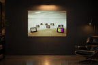Television Project No. 06 — Drift — photo print shown in a dark gallery room under a picture light
